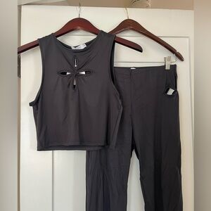 Black matching set with floral cut outs on top and pants! Never worn